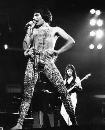 IMAGO ICONS: Freddie Mercury May 12, 1978; London, England, UK; Lead singer of Queen FREDDIE MERCURY on stage with his band at Wembley Arena.. London UK  - ZUMAk09