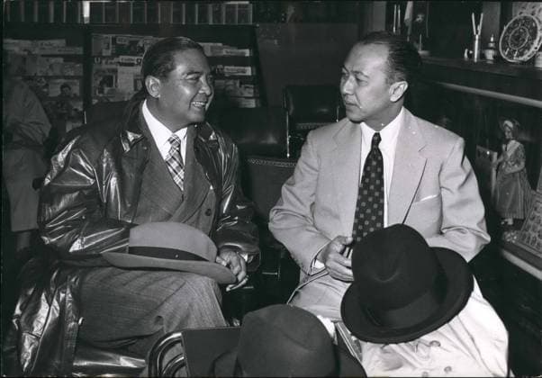May 05, 1954 - Off To Washington M. Pote Sarasin, Thailand Ambassador to Washington (right) has a farewell chat with Prince Wan, head of the Thailand Delegation to the Geneva conference, prior to boarding the plane for Washington.  - ZUMAk09