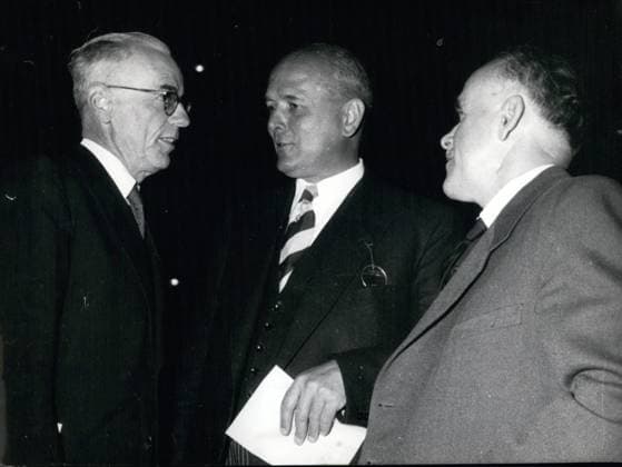 Sep. 09, 1954 - Within the family remained the conversation of the three gentleman on our picture. They are from left to right: President of the U.I.O Dr. Veillard (Geneva), Ministre in family affair: Dr. Franz Wurmeling and the Ministre in family affairs from Luxembourg: Dr. Frieden. They opened in Stuttgart the world meeting of the International family organization.  - ZUMAk09