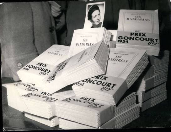 Dec. 06, 1954 - The Goncourt Academy have awarded their prize to Simone de Beauvoir for her book Les Mandarins at the press conference given by her editor; she was not present. Here, in front of stacks of her book, a photo of Simone de Beauvoir.  - ZUMAk09