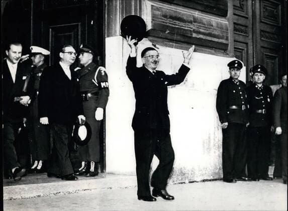 May 05, 1955 - Figl is greeting rejoicing people: Foreign Minister Dr. Leopold Figl is leaving the building of the the Allied Counsel after the conference of the five Powers  - ZUMAk09