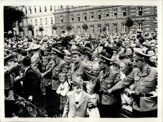 Jul. 27, 1955 - Jubilant scenes as Austria receives her freedom: The red and white flags of the Austrian republic were hoisted over Vienna today, replacing those of the four occupying Powers, as Austria became a free country for the first time since the German troops moved in March 1938. Photo Shows The people of Vienna gathered in front of the Allied Council building to watch military units of the occupation Powers parade outside.  - ZUMAk09