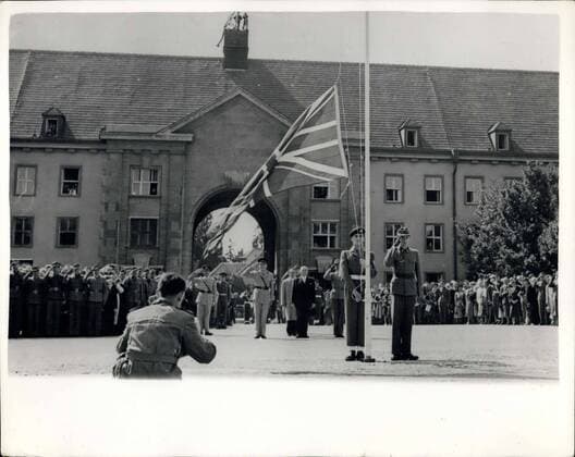 Sep. 12, 1955 - Schoenbrunn Barracks Handed Over To Austrian Army. The British Ambassador in Austria, Sir Geoffrey Wallinger, attended the ceremonial parade at the Schoenbrunn Barracks in Vienna on Saturday - when the barracks were handed over by British Forces to the Austrian Army. Keystone Photo Shows:- The Union Jack is hauled down by a British soldier - during the handing-over ceremony at the Schoenbrunn Barracks, Vienna.  - ZUMAk09