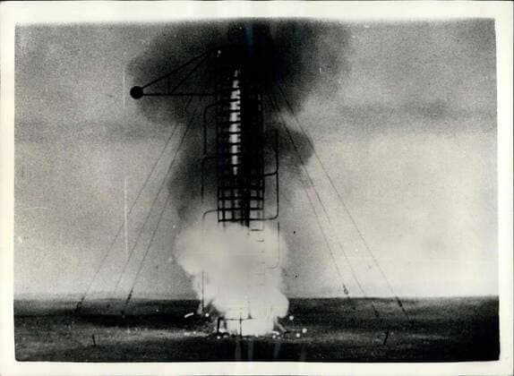 Nov. 04, 1957 - Soviet sends up Sputnik II .. new picture of their experiments with Dog carrying Rockets... Coinciding with the news that the Soviet has released Sputnik II -satellite-pictures have been received in London-illustrating recent experiments by Soviet Scientists the release of dog carrying space rockets. The dog was sent up in a globe inside a rocket to height of 100 kilometres, The dog had a safe landing by means of a parachute.. Photo shows The rocket-containing the dog is released. It went up to a height of 100KM- and the dog came safely down-by parachute.  - ZUMAk09