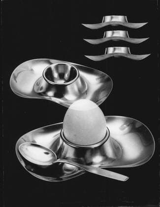 Designklassiker von Wilhelm Wagenfeld Mar. 04, 1958 - Not meant for Easter eggs is this beautifully shaped and also practical WMF egg cup out of rust free cromagan, designed by professor Wilhelm Wagenfeld. The broad brink is gathering the egg s shells, no spots may be found on the table cloth, surely a great thing for every house wife.  - ZUMAk09