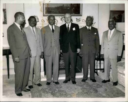 Sep. 09, 1958 - Mr.Macmillan meets commonwealth ministers at No. 10 downing street. Mr Harold Macmillan the Prime Minister this afternoon met common wealth Ministers at No.10 Downing Street this afternoon in order to discuss the recent outbreak of Race violence in the Notting Hill area of London. Photo shows The group at No.10 Downing street this afternoon left to right Dr.Patrick Solomon (Dep. Chief Minister of Trinidad); The .Hon Ram Karran (Minister for Communications and works- British Guiana); Mr.N.W Manley (Chief Minister of Jamaica ); The Rt. Hon . Mr Harold Macmillan; Dr. Carl la Corbiniers (Dep. Prime Minister - West Indies Federation ); and Dr. H.E.H Cummins , C.B.E., (Premier of Barbadoes)  - ZUMAk09