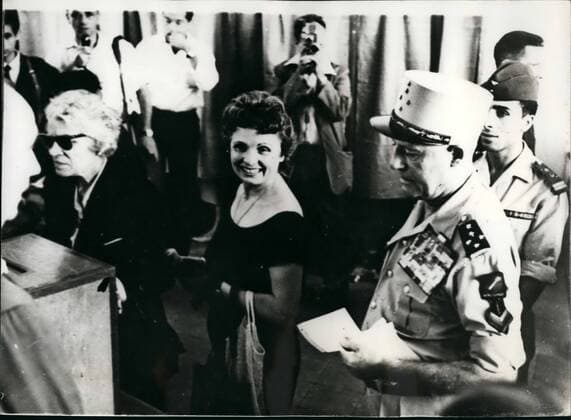 Sep. 09, 1958 - Algeria Votes. Keystone Photo Shows:- General and Madame Salan seen surviving at the polling station in Algiers, to cast their vote on the new De Gaulle Constitution.  - ZUMAk09