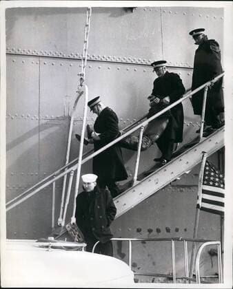 Mar. 03, 1961 - Demonstrators Squats on Nuclear Sub s Tailfin: An anti-Polaris demonstrator sat above the waves on the tailfin of America s nuclear submarine Patrick Kenry - for 45 minutes yesterday - in the Holy Loch. He stayed there until removed by police. He was on of three commandos who went aboard the vassal - two of them were hauled up the side- and then went into their passive resistance drill - and the other sat on the tailfin. Photo shows One of the commandos - in carried off - after the demonstration - in the Holy Loch yesterday.  - ZUMAk09