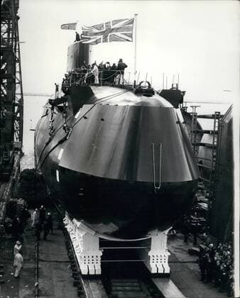 Sep. 09, 1966 - Queen Mother Launches Polaris Submarine: Queen Elizabeth the Queen Mother today launched Britain s first Polaris Submarine, H.M.S. Resolution, at Barrow in Furness. H.M.S Resolution is the first of four British Polaris submarines now being built to be launched. About 7,000 tons, she is due to begin operational patrols in May, 1968, armed with 16 Polaris missiles with a range of 2,500 nautical miles. All four Polaris submarines should be operational by 1970. Photo shows H.M.S Resolution slips down to the sea after being launched by H.M Queen Mother.  - ZUMAk09