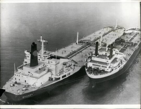 May 05, 1969 - Oil Transfers At Sea Begin Off Britain Holiday Beaches: The shell tankers Macoma, 207,000 tons, and Drups, 70,000 tons, linked off Torbay, Devon yesterday during the first massive transfer to crude oil from one vessel to another. Off the holiday beaches of Britain. Nearly 70,000 tons of oil is being transferred in an 18-houroperation ending this morning. The macoma has to unload part of her cargo at sea because no port serving a shell refinery has yet dredged a channel deep enough for the fully-laden tankers in the 200,000-ton class. Shell is buying or chartering 29 such ships. Oil transfers will take place twice a week outside British territorial waters until deep water facilities are ready in 1970 at Rotterdam, Le Havre, Gothenburg, and Fos, near Marseiulles, Areas elected for transfers are lyne Bay, the Suffolk coast north of Felixstowe, the Liverpool sid eof the Bay of - ZUMAk09