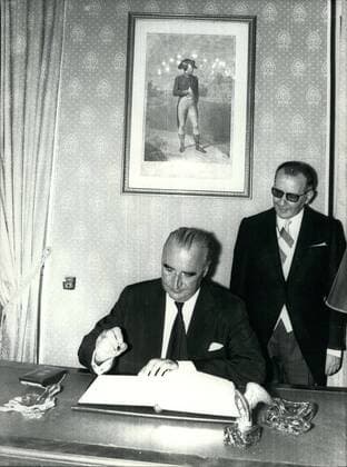 Aug. 16, 1969 - President Pompidou attended ceremonies marking the bicentennial of Napoleon I s birth. Georges Pompidou signs the Golden Book in the city hall of Ajaccio. The Mayor, Pascal Rossini is behind him.  - ZUMAk09