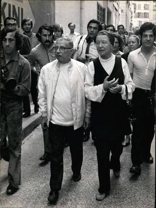 Jun. 27, 1970 - Jean-Paul Sartre and Simone de Beauvoir were arrested last night around one in the morning on Boulevard Poissonniere, while in the company of 20 people distributing issues of The People s Cause . They are pictured being released from the police station.  - ZUMAk09