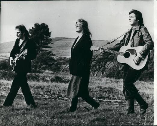 Oct. 10, 1974 - A Stroll in the Heather: Paul McCartney, with his wife Linda and Denny Laine make sweet music in the Highlands of Scotland. Photo shows (L-R) Denny, Linda and Paul strolling in the heather during filming of the promotional film for their new single Mill of Kintyre  - ZUMAk09