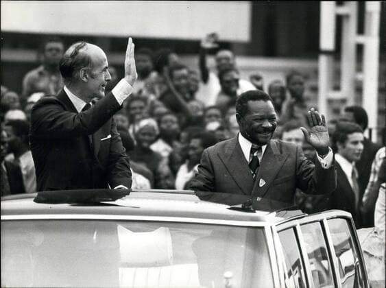 Mar. 06, 1975 - They are in a car riding through Bangui after Giscard d Estaing was welcomed to the Central African Republic by Jean Bedel Bokassa.  - ZUMAk09