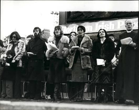 Nov. 11, 1976 - Thousands Take Part I Under Peace Rally Through The Westend of London: Thousands of people took part in the Ulster peace Rally in London today. The march was led by the peace leaders Mrs Betty Williams, and Miss Maircad Corrigan. They left Hyde Park Corner finishing with a rally in Trafalgar Square. On the platform to address the rally were, The Archbishop of Canterbury, Dr. Donald Coggan. The Archbishop of Westminster Cardinal Hume. the singing of the peace song was led by Joan Baez, the American folk singer. Photo Shows: Seen on the platform in Trafalgar Square L-R Mrs Betty Williams, with her daughter Debra aged 5, Mr Ciaran McKeown, co-founder of the peace movement. Mrs Jane Eward - Biggs, the wife of the British Ambassador killed in Dublin, Joan Baez American folk singer Miss Corrigan, and the Archbishop of Canterbury Dr Donald Coggan.  - ZUMAk09