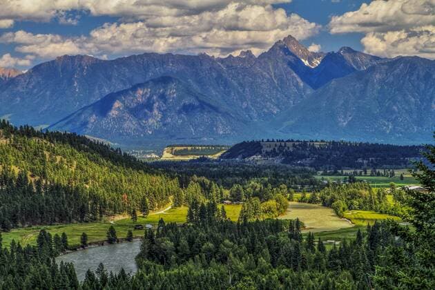 East Kootney Mountains and Fisher Peak. Looking east to Fisher Peak, of the East Kootnenay range and St. Mary river. Cranbrook, British columbia, Canada  acp72132