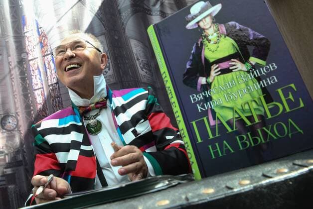 ITAR-TASS: MOSCOW, RUSSIA. AUGUST 18, 2014. Fashion designer Vyacheslav Zaitsev smiles at a presentation of his book A Date dress written in collaboration with Kira Burenina at the 12th International Specialized Exhibition of Headwear Raw Materials and Accessories Chapeau 2014 , at Moscow s Gostiny Dvor.  premiumd RE14D265