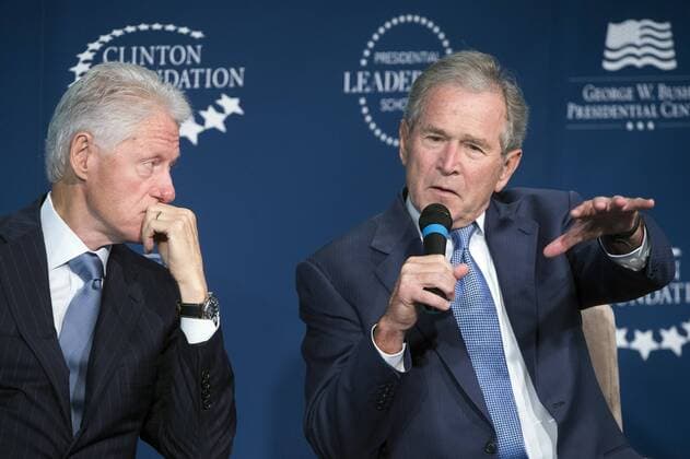 Former Presidents Bill Clinton (L) and George W. Bush participate in a discussion during the launch of the Presidential Leadership Scholars program at the Newseum in Washington, D.C. on September 8, 2014. The program will cultivate leadership skills in exceptional candidates in government, business and academia.  WAP20140908304
