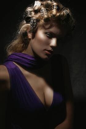 Young woman wearing hair rollers, close-up model released  KE00049