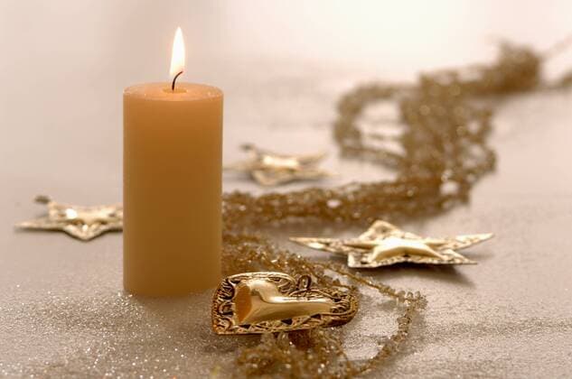 Christmas decoration with star and heart-shaped ornaments and burning candle  ASF02482