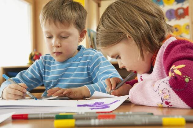 Germany, Children in nursery drawing pictures, portrait model released property released  RNF00226