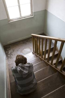 Boy (12 years) sitting in staircase, rear view model released  WDF00366