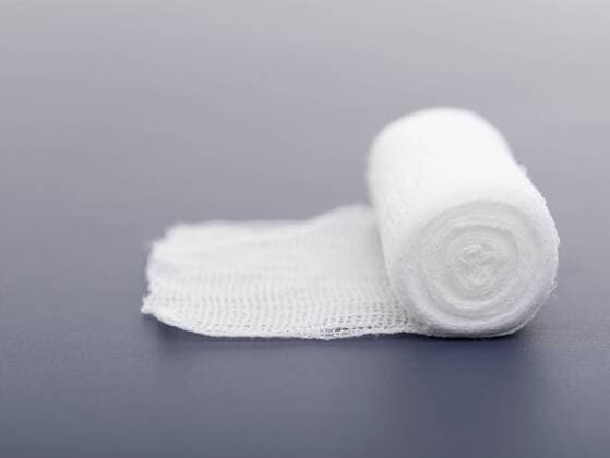 Gauze bandage on gray background  KNF001079