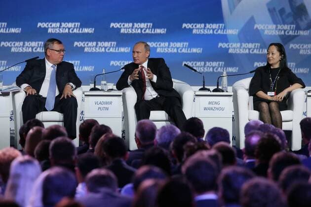 MOSCOW, RUSSIA. OCTOBER 2, 2014. Andrei Kostin, President and Chairman of the Management Board, Member of the Supervisory Council of VTB Bank, Russia s president Vladimir Putin and Huawei Technologies executive director Wanzhou Meng (L-R) attend the 6th VTB Capital Investment Forum Russia Calling at the Moscow World Trade Centre. MikhailMetzel TASS  RE150CB0