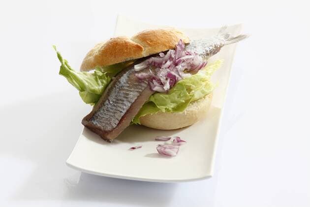 Sandwich stuffed with salted herring in plate  CSF015458