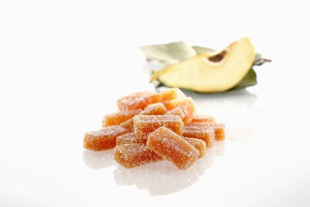 Pieces of quince jelly on white background  DIKF000033