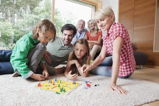Germany, Bavaria, Nuremberg, Family playing board game together model released property released  RBYF000142