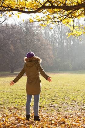 Germany, Berlin, Wandlitz, Mid adult woman standing in sunlight model released  WESTF018318