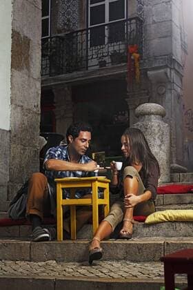 Portugal, Lisboa, Bairro Alto, young couple sitting at street cafe at dusk model released  BIF000004