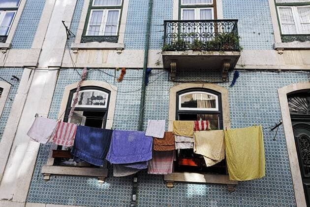 Portugal, Lisbon, Mouraria, part of house front with drying laundry  BIF000139