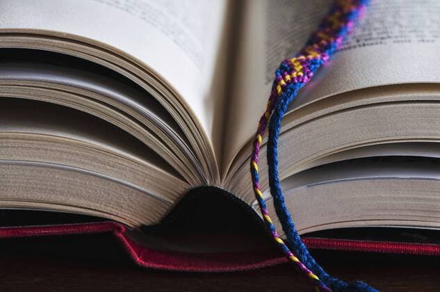 Part of an opened book with bookmark  MOF000193