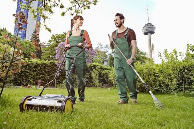 Germany, Cologne, Young couple gardening, smiling model released property released  RHYF000416