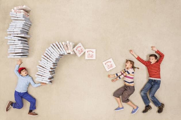 Boy delivering stack of pizzas model released Symbolfoto  BAEF000902