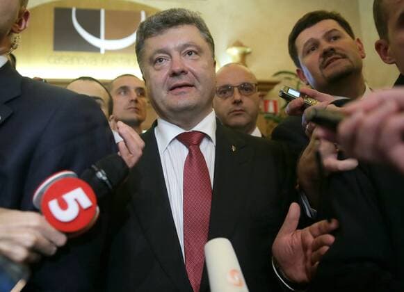 MILAN, ITALY. OCTOBER 17, 2014. Ukraine s president Petro Poroshenko talks to the media after a meeting with the leaders of Russia, Germany and France on the sidelines of the 10th ASEM (Asia-Europe Meeting) Summit at Milan s MiCo (Milano Congressi) Convention Centre. Mikhail Metzel TASS  RE152238