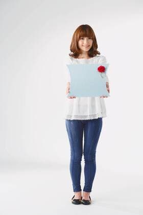 Full length portrait of young Japanese woman against white background  (jjig001759)