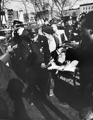 New York, New York: February 21, 1965 Black activist Malcolm X is carried from the Audubon Ballroom where he had just been shot. He died shortly after. 990_16_X-MalcolmX_1HR