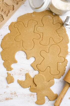 Gingerbread dough with gingerbread man cookie cutter  ODF000839
