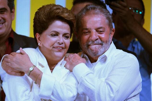 BRASILIA, Oct. 26, 2014 -- Brazil s President and presidential candidate of the Workers Party Dilma Rousseff (L) and Former President Luiz Inacio Lula da Silva (R) celebrate after the results of presidential runoff were released in Brasilia Oct. 26, 2014. Dilma Rousseff was reelected on Sunday, official results showed. Rousseff garnered 51.52 percent of the votes while her rival Aecio Neves of the Social Democrat Party got 48.48 percent as 99 percent of the ballots were counted, the Supreme Electoral Court said. ) (vf) (ce) (BRAZIL OUT) BRAZIL-BRASILIA-POLITICS-ELECTIONS AGENCIAxESTADO 
