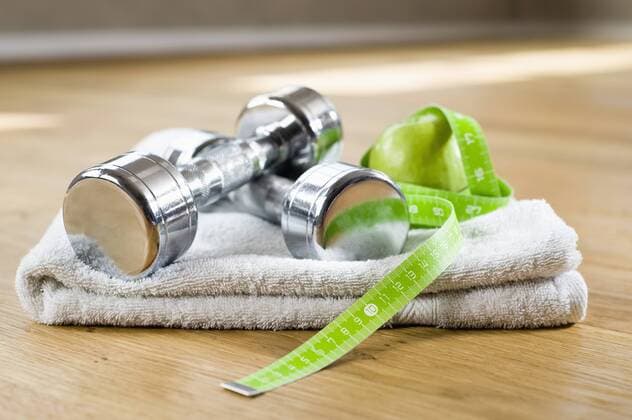 Close up white towel apple barbells tape measure mit_2003_01997