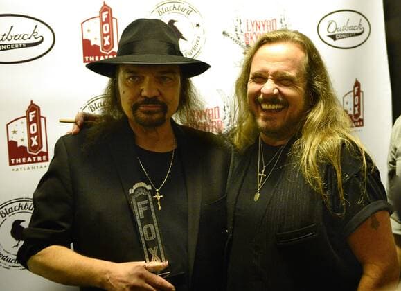 Southern rockers Gary Rossington (L) and Johnny Van Zant (R) of Lynyrd Skynyrd arrive for One More For The Fans! - Celebrating The Songs & Music of Lynyrd Skynyrd, a special concert featuring once-in-a-lifetime collaborations by friends and admirers paying tribute to Lynyrd Skynyrds four decades of southern-based rock music at the Fox Theatre in Atlanta on November 12, 2014. The band s live album recorded in the theatre 40 years ago helped save the historic structure from destruction.  AJP2014111227