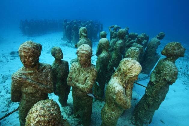 Submarine statues at the MUSA Cancun Underwater Museum, a conservation project to promote the growth of coral. Isla Mujeres, Cancun National Park, Caribbean Sea, Mexico.  1391518 ClaudioxxContreras
