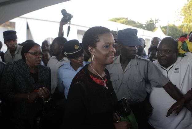 (141203) -- HARARE, Grace Mugabe (front), wife of Zimbabwe s President Robert Mugabe, is escorted to tour the venue for the ruling party ZANU PF s elective congress in Harare, capital of Zimbabwe, Dec. 2, 2014. Grace Mugabe is widely expected to be elected as the ruling party s head of the women s league and a member to the Politburo, fueling speculation that she is being groomed to take over his husband for the top position. ) ZIMBABWE-HARARE-GRACE MUGABE-ELECTIVE CONGRESS Stringer 