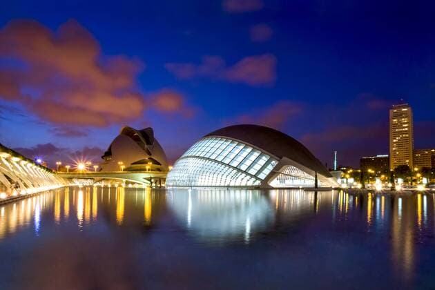 Spain, Valencia, view to lighted L Hemisferic and Palau de les Arts Reina Sofia at City of Arts and Sciences  PU000340