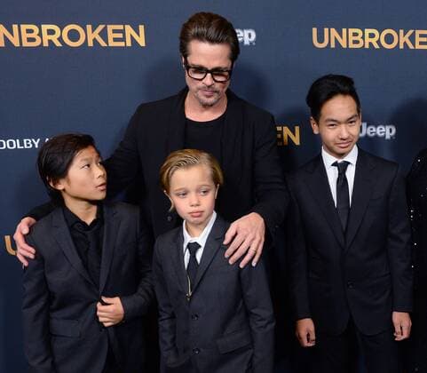 Actor Brad Pitt attends the premiere of the biographical motion picture war drama Unbroken with his children Pax Thien Jolie-Pitt, Shiloh Nouvel Jolie-Pitt, Maddox Jolie-Pitt (L-R) at the Dolby Theatre in the Hollywood section of Los Angeles on December 15, 2014.  LAP2014121553
