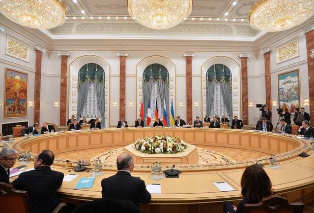 MINSK, BELARUS. FEBRUARY 11, 2015. During Normandy format Ukraine peace talks with the participation of Russia s president Vladimir Putin, Germany s chancellor Angela Merkel, France s president Francois Hollande and Ukraine s president Petro Poroshenko at the Palace of Independence in Minsk. Alexei Druzhinin Russian presidential press service TASS  RE15BA73