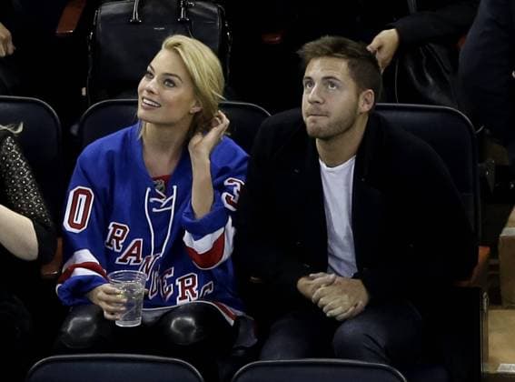 Margot Robbie and Tom Ackerley watch the Arizona Coyotes play the New York Rangers at Madison Square Garden in New York City on February 26, 2015.  NYP20150226104 JOHNxANGELILLO